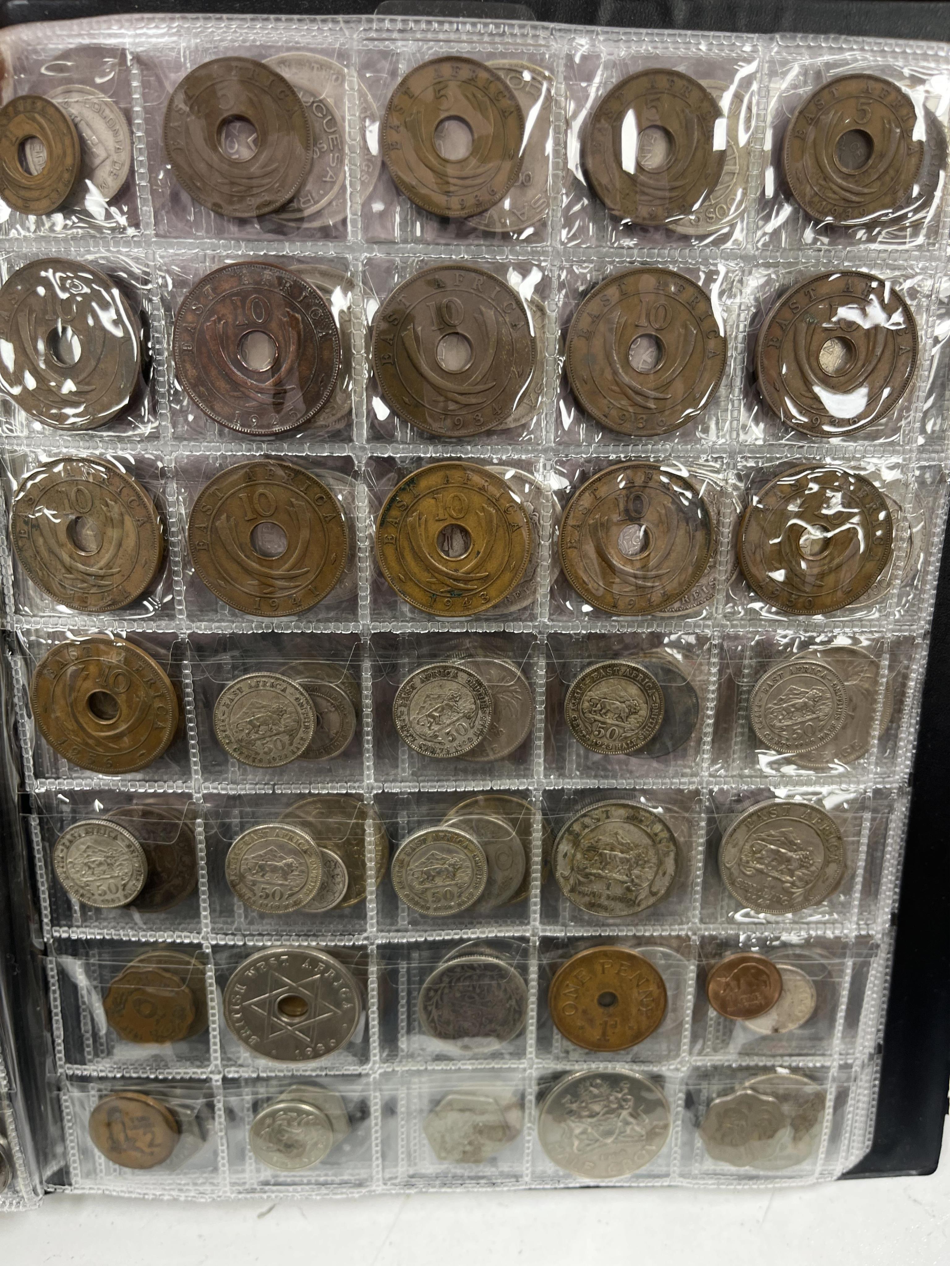 Southern Rhodesia, South Africa and Europe coins, early to late 20th century, and Victoria, and later pennies, Rhodesia, Japan, Zimbabwea banknotes, in two albums